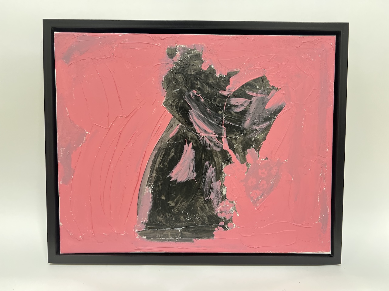 Thick black gestural form rising through a heavily textured pink field, modeling-paste relief.